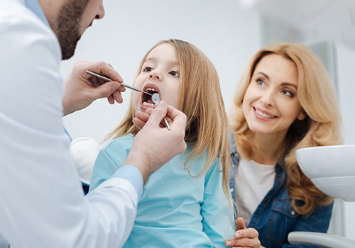Young girl receiving dental checkup