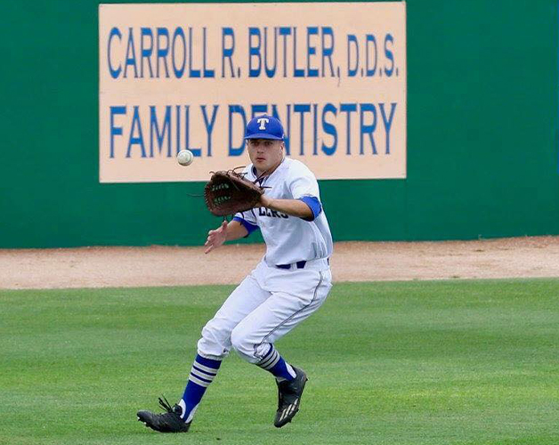 Carroll R Butler DDS Family Dentistry sign at baseball park