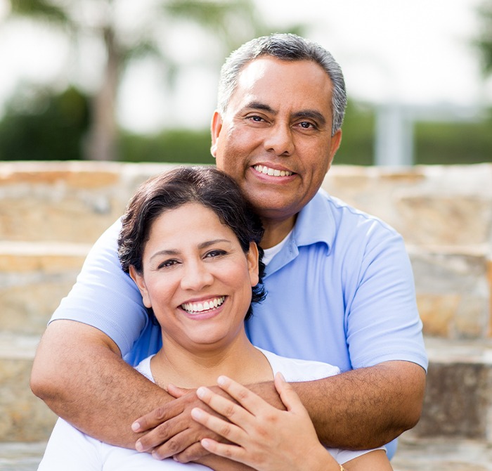 Older couple smiling after visiting emergency dentist in Kerrville