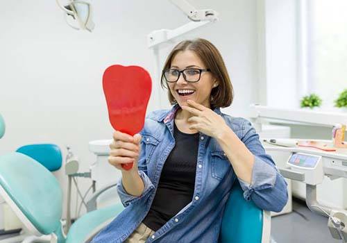 Woman smiling after having her toothache in Kerrville treated