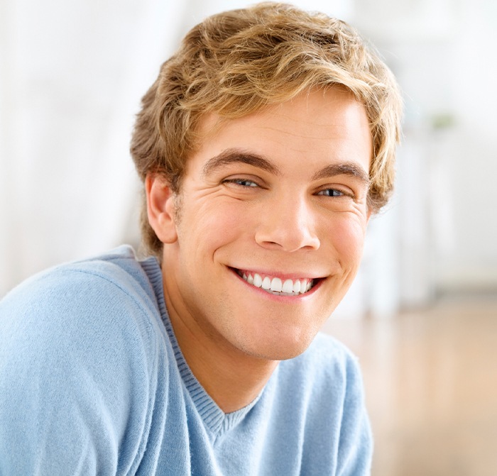 Man sharing smile after tooth extraction