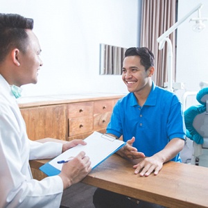 Patient speaking with an implant dentist in Kerrville