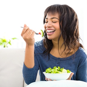 Woman eating salad in Kerrville
