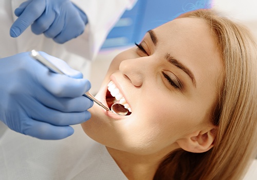 Woman receiving dental checkup