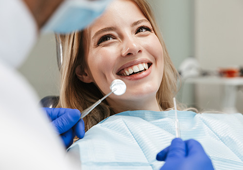 Woman smiling during oral cancer screening