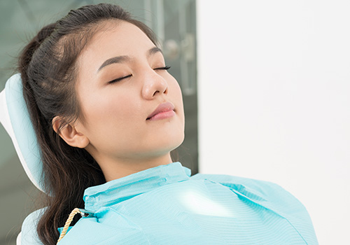 Relaxed woman with eyes closed after oral conscious sedation dentistry