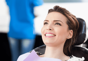 Woman smiling during preventive dentistry appointment