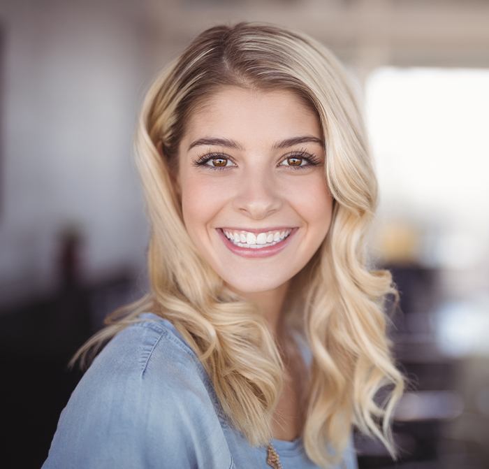 Woman sharing beautiful smile after tooth-colored fillings