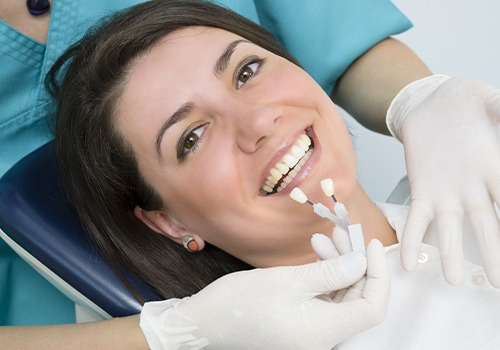 Patient reviewing porcelain veneer shade options