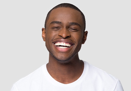 Man sharing brilliant smile after teeth whitening