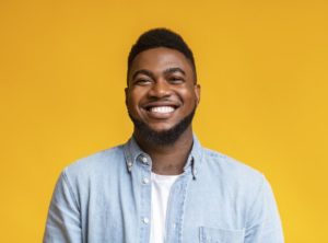 man smiling after getting cosmetic dentistry work done 