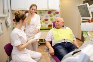 mature man smiling in dental chair