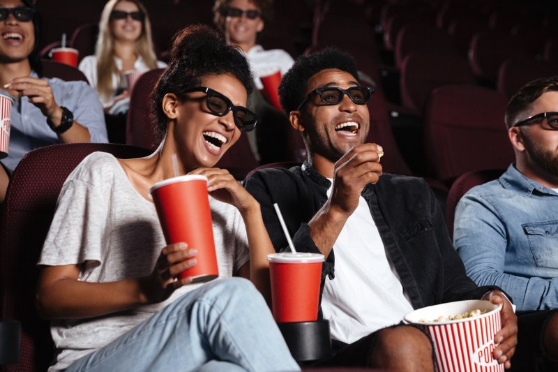 Couple watching a movie after cosmetic dentistry